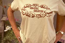 Woman's shirt: 'Cowgirl Caravan' with a circling of camping trailers